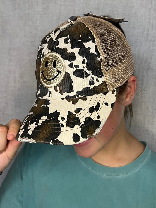 COW PRINT HAT W/ SMILEY GLITTER PATCH